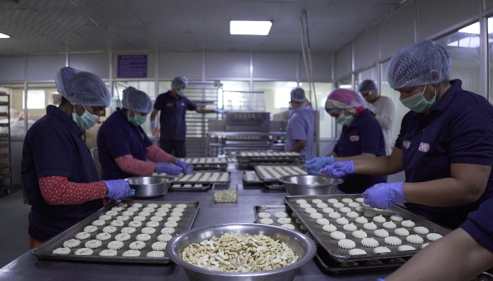 Workers making snacks